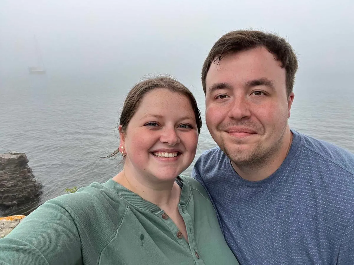 My girlfriend and I taking a selfie on the coast on a foggy day.