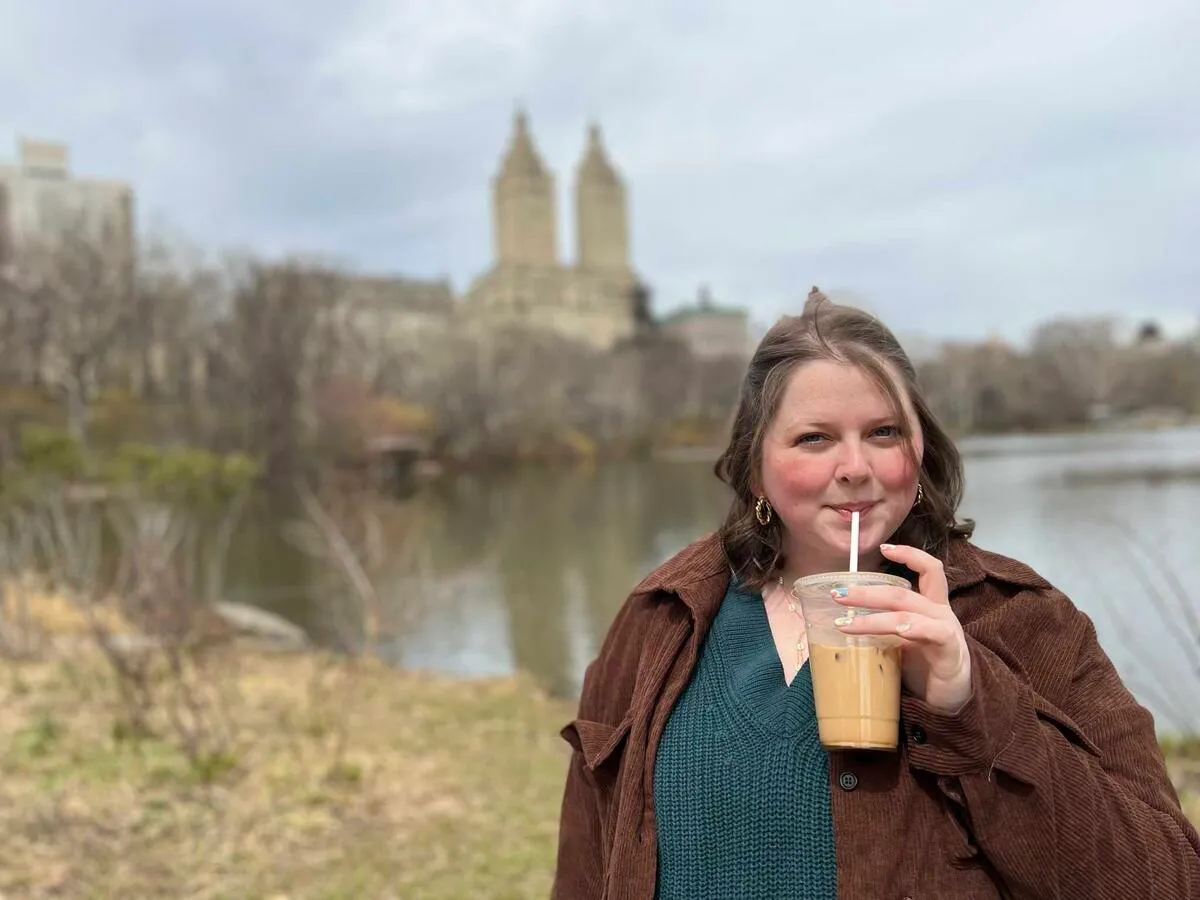 Roxanne in Central Park in New York City, sipping on a latte.