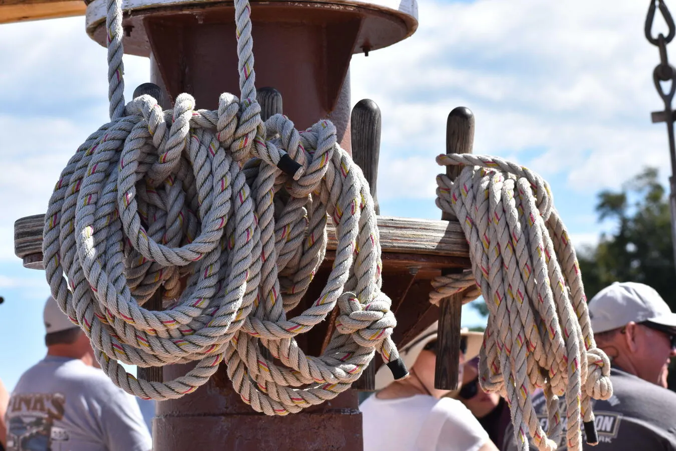 An artistic, zoomed in photo of rope coils securing the sails of a schooner.