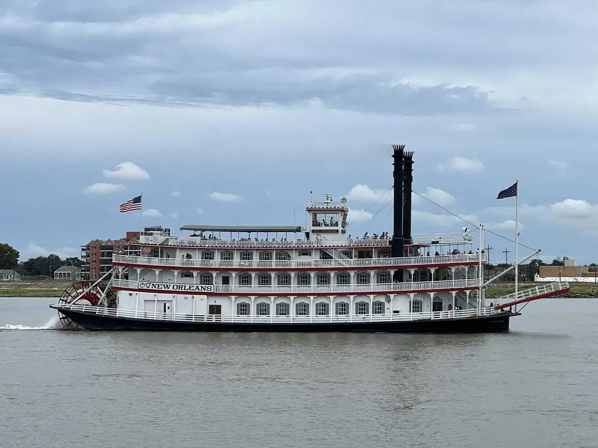 A steamboat traveling down the Mississippi River in New Orleans.